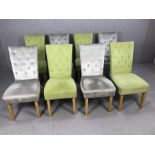 Eight contemporary high back upholstered dining chairs, four upholstered in pale green, four in
