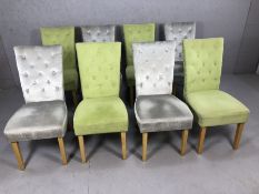 Eight contemporary high back upholstered dining chairs, four upholstered in pale green, four in