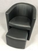 Single modern black tub chair with pull-out foot stool