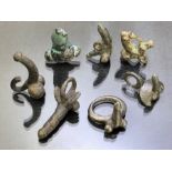 Collection of seven phallic pendants or rings, of varying ages, some possibly Roman, the longest
