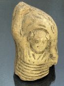 Fragmentary pottery figure, possibly Roman, with depiction of horizontal material markings to