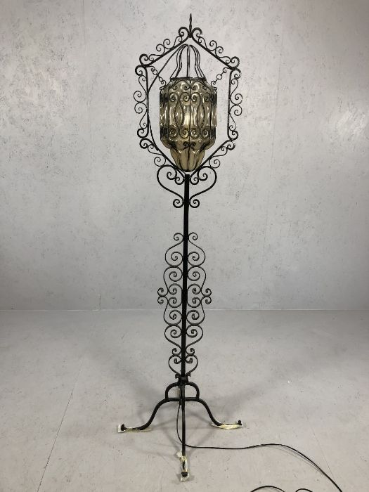 Wrought iron standard lamp with glass suspended shade approx 180cm in height