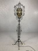Wrought iron standard lamp with glass suspended shade approx 180cm in height