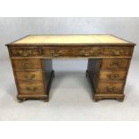 Twin pedestal desk with cream leather top, original brass handles, three drawers to each pedestal