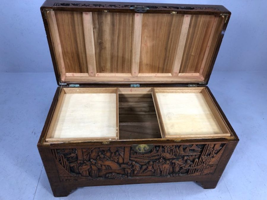 Heavily carved Chinese camphor wood chest with two internal trays, approx 103cm x 52cm x 60cm - Image 4 of 8