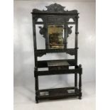 Large Green Man hall stand, heavily carved with drawer to centre, bevel edged mirror with aged