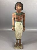 Wooden shabti with black, green and white pigmented detailing to face and body, approx 29 cm in