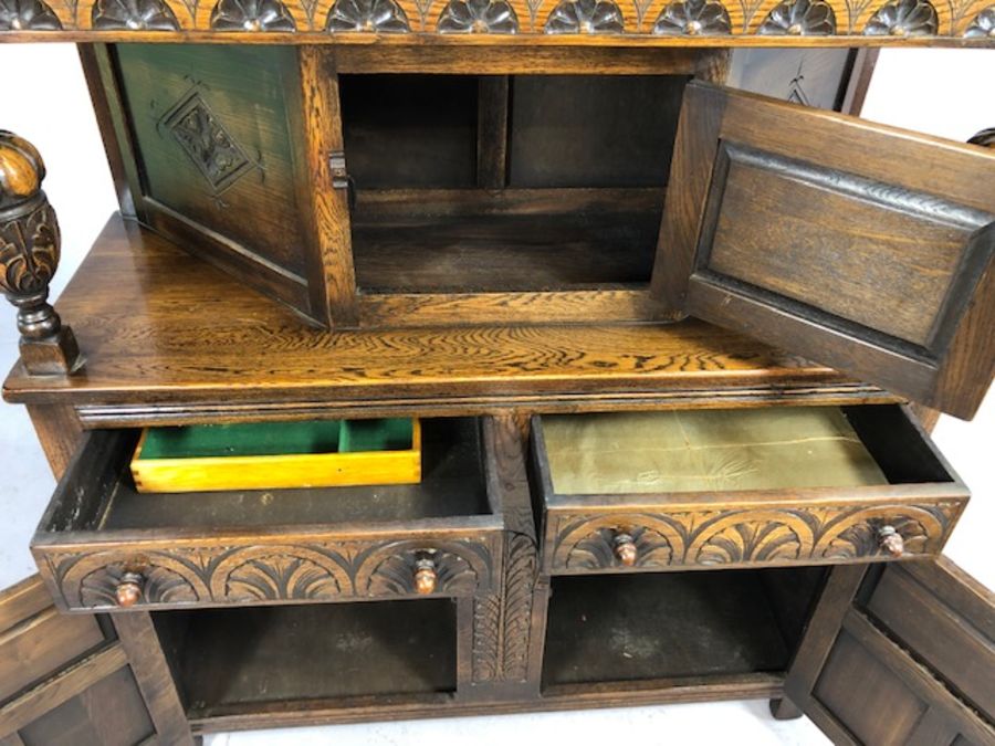 Carved oak buffet with baluster columns, carved detailing, cupboards and drawers, approx 122cm x - Image 4 of 5