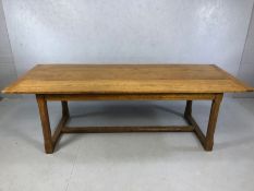 Refectory table of three blank design with pegged breadboard ends, octagonal carved legs and cross