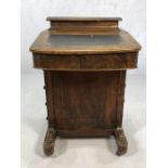 Antique Davenport writing desk with inlay leather top and a flight of four drawers to right hand