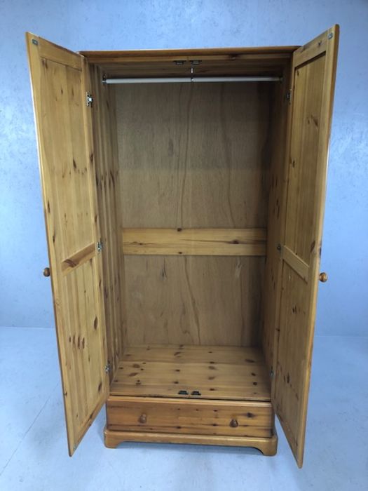 Pine single two door wardrobe with hanging rail and cupboard under, approx 86cm x 52cm x 179cm - Image 2 of 4