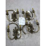 Set of four boxed cast brass Fleur de Lis design double arm wall lights by Jim Lawrence