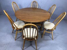 Ercol drop leaf table and six stick back chairs, table approx 128cm wide x 140cm in length (fully
