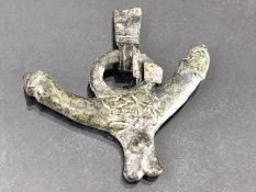 Bronze phallus pendant, clenched fist to one end, phallus to other, with neck hanging attachments,