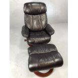 Brown leather recliner swivel chair with matching foot stool