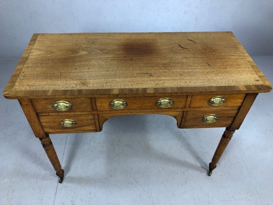 Antique kneehole writing desk on turned legs with original castors, five drawers and brass - Image 2 of 6