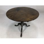 Circular antique table on three footed pedestal base, approx 85cm in diameter
