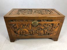 Heavily carved Chinese camphor wood chest with two internal trays, approx 103cm x 52cm x 60cm