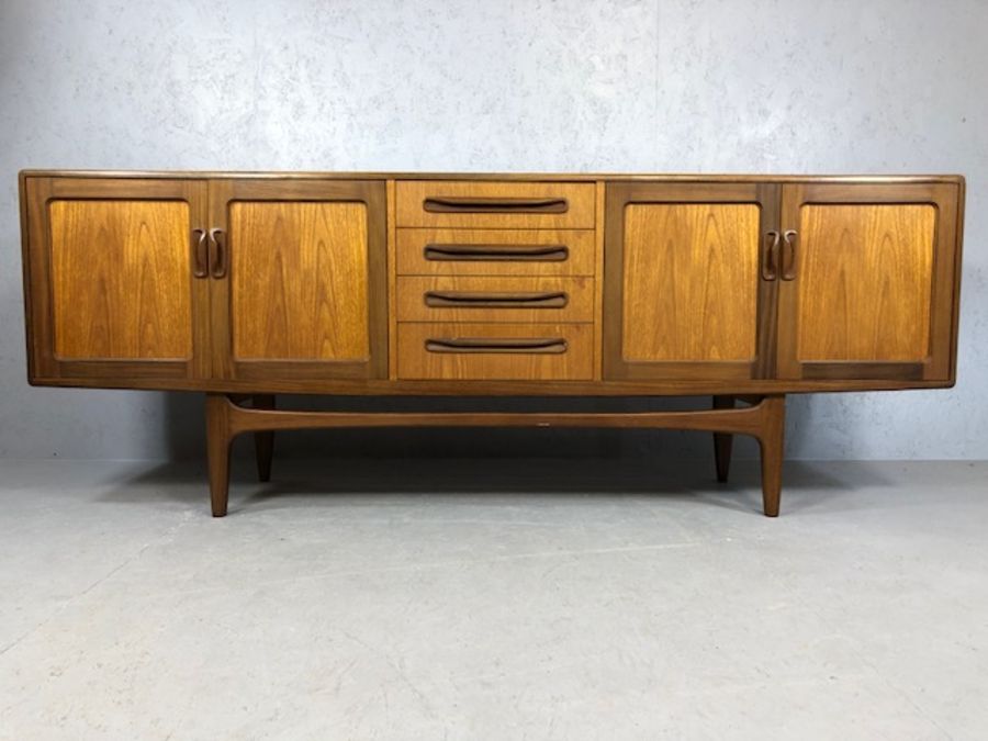 Mid Century red label G-Plan sideboard with cupboards either side and drawers to centre, raised on - Image 6 of 8