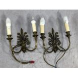 Pair of cast brass Fleur de Lis design double arm wall lights by Jim Lawrence