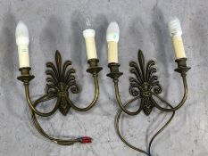 Pair of cast brass Fleur de Lis design double arm wall lights by Jim Lawrence