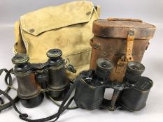 Two pairs of WW1 binoculars, one by L. Petit from Paris and W Watson & Sons from London, with a