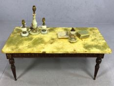 Marble-topped coffee table on wooden frame with a collection of marble dressing table items
