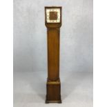 Grandmother clock with carved detailing, pendulum, key and chimes, approx 152cm tall