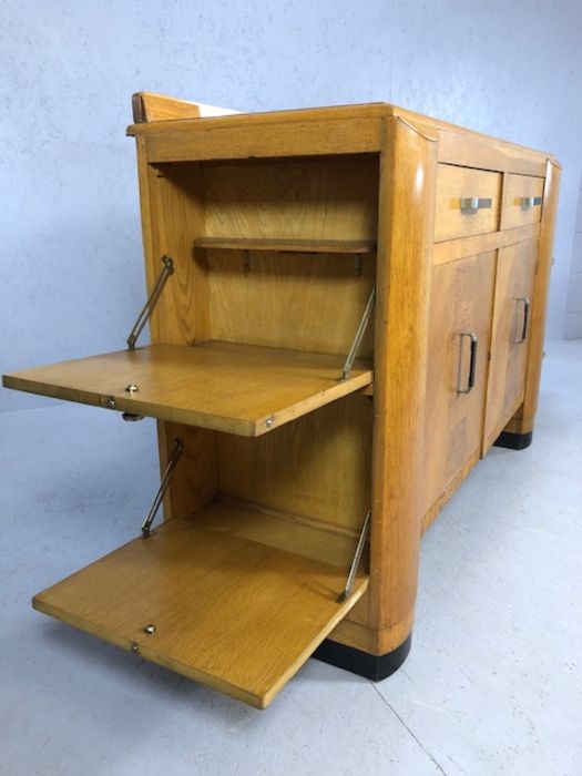 Pine Art Deco style sideboard and drinks cabinet with dropdown cupboards to either end, two drawers, - Image 6 of 7