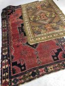 Two vintage woollen rugs, the largest approx 260cm x 144cm