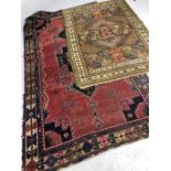 Two vintage woollen rugs, the largest approx 260cm x 144cm