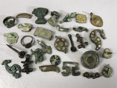 Collection of artefacts, possibly metal detecting finds, many bronze, to include badges,