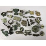 Collection of artefacts, possibly metal detecting finds, many bronze, to include badges,