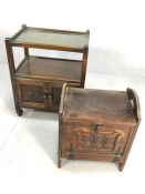 Wooden carved wine rack and an oak drinks trolley with cupboard under