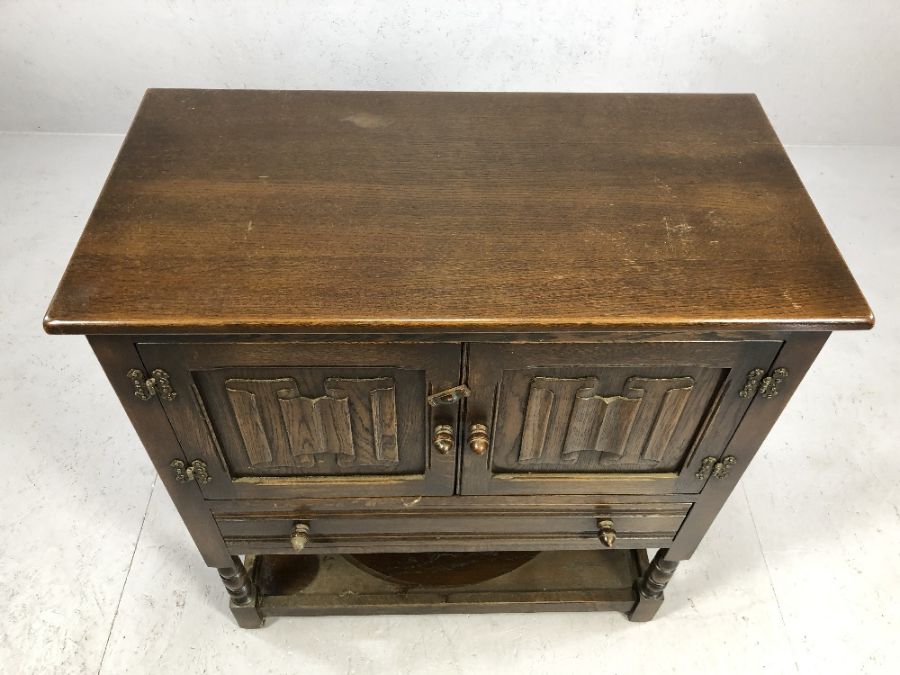 Small oak sideboard of linen fold design with cupboard, drawer and shelf to base, approx 79cm x 41cm - Image 2 of 4