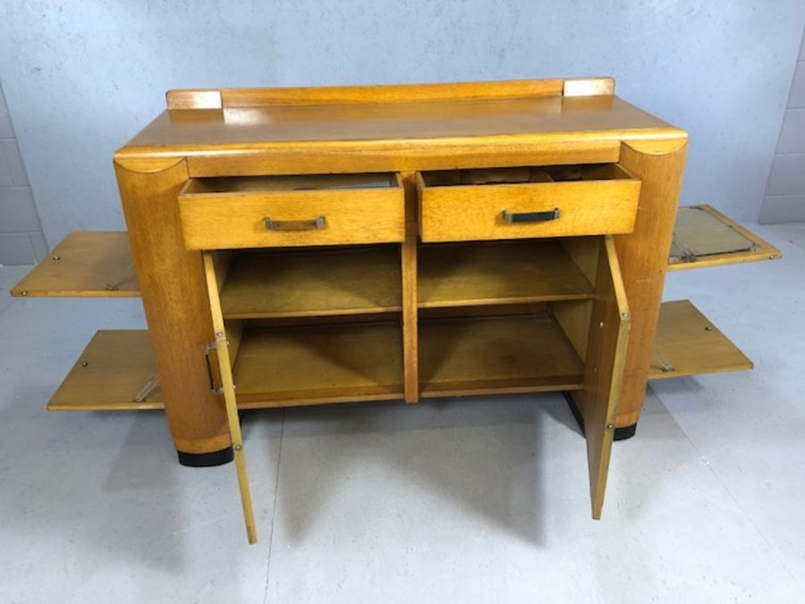 Pine Art Deco style sideboard and drinks cabinet with dropdown cupboards to either end, two drawers, - Image 4 of 7