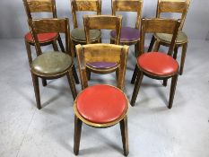 Set of eight vintage multicoloured circular seat pad chairs