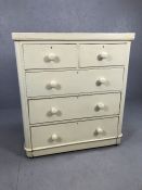 White painted pine chest of five drawers with bun handles