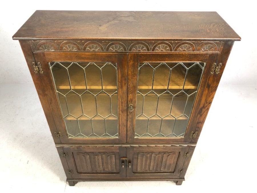 Oak linen fold book case with leaded and glazed doors, cupboard under, approx 99cm x 33cm x 135cm - Image 2 of 4