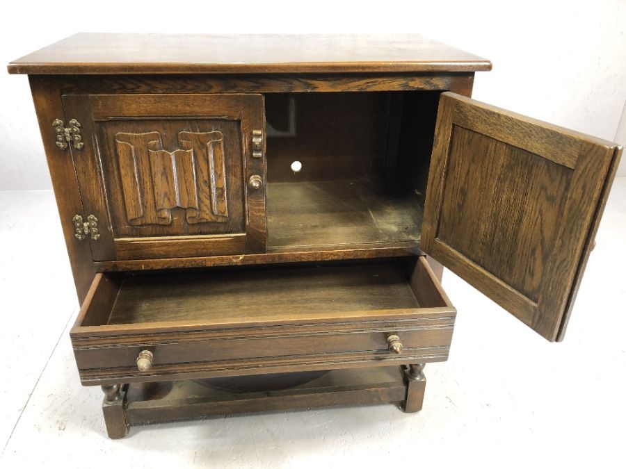 Small oak sideboard of linen fold design with cupboard, drawer and shelf to base, approx 79cm x 41cm - Image 3 of 4