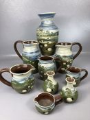 Collection of hand Made Caroline Smith Abbot Pottery made in Devon to include vases and jugs (9