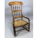 Cane seated wooden rocking chair