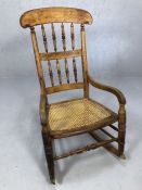 Cane seated wooden rocking chair