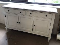 Modern white painted sideboard on turned legs with two drawers and cupboards under, approx 140cm x