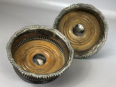 Pair of Silver coloured Wine Bottle coasters with wooden inserts