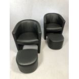 Pair of modern black tub chairs with pull-out foot stools