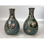 Pair of Cloisonné vases with floral design on blue ground, each approx 12cm in height