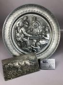 Collection of metalware to include a Dutch pewter plate with tavern scene and angel stamp to back,