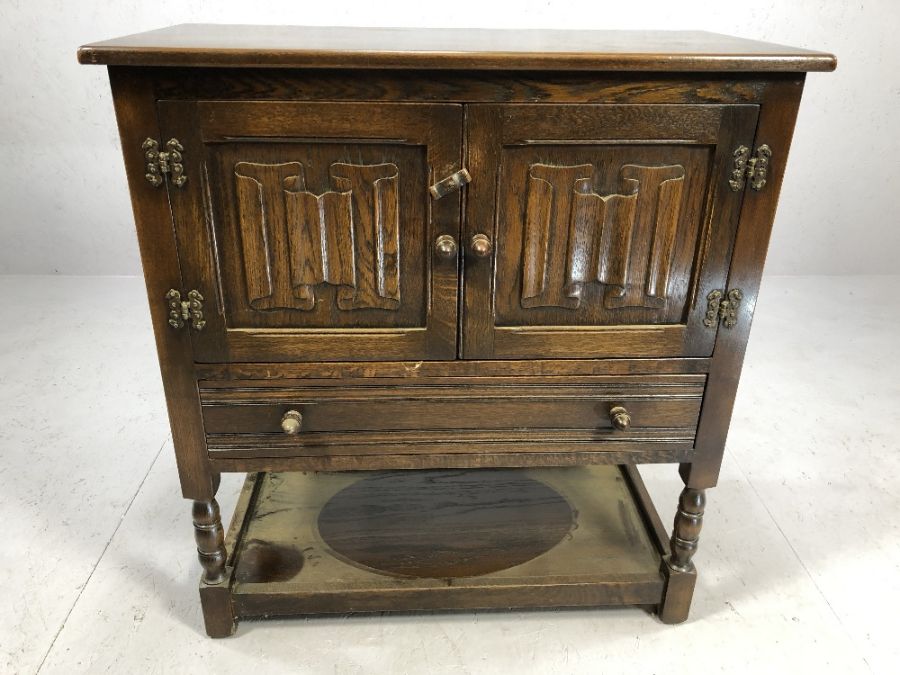 Small oak sideboard of linen fold design with cupboard, drawer and shelf to base, approx 79cm x 41cm