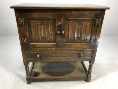 Small oak sideboard of linen fold design with cupboard, drawer and shelf to base, approx 79cm x 41cm